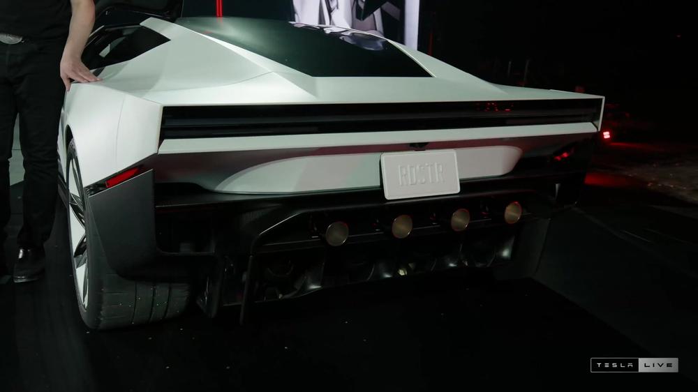 Close-up of the new white Tesla Roadster’s rear on the event stage
