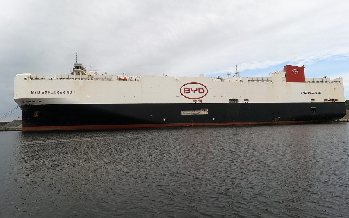 The BYD Explorer No.1 car carrier ship, white and black with the BYD logo on its side