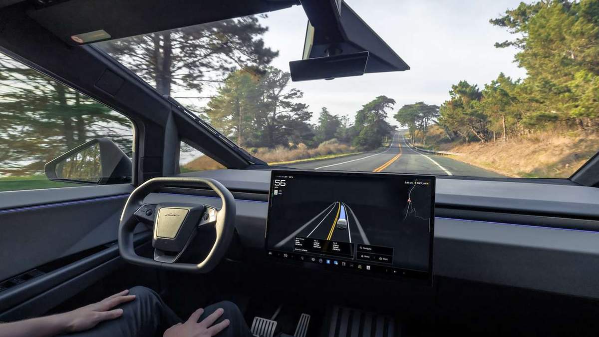 Inside a Tesla Cybertruck with FSD (Supervised) engaged, the driver's hands in their lap and the road visualisation on the centre screen