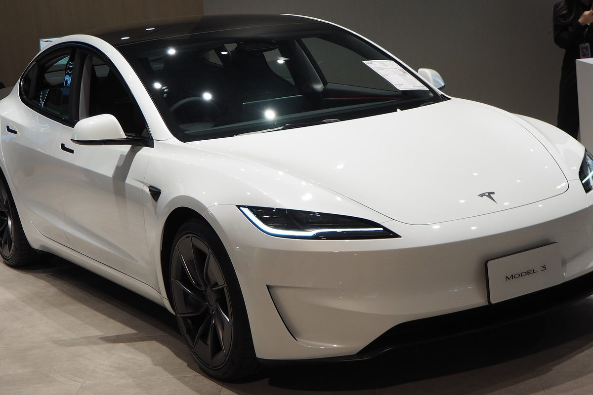 White Tesla Model 3 Performance, Highland generation, in a showroom