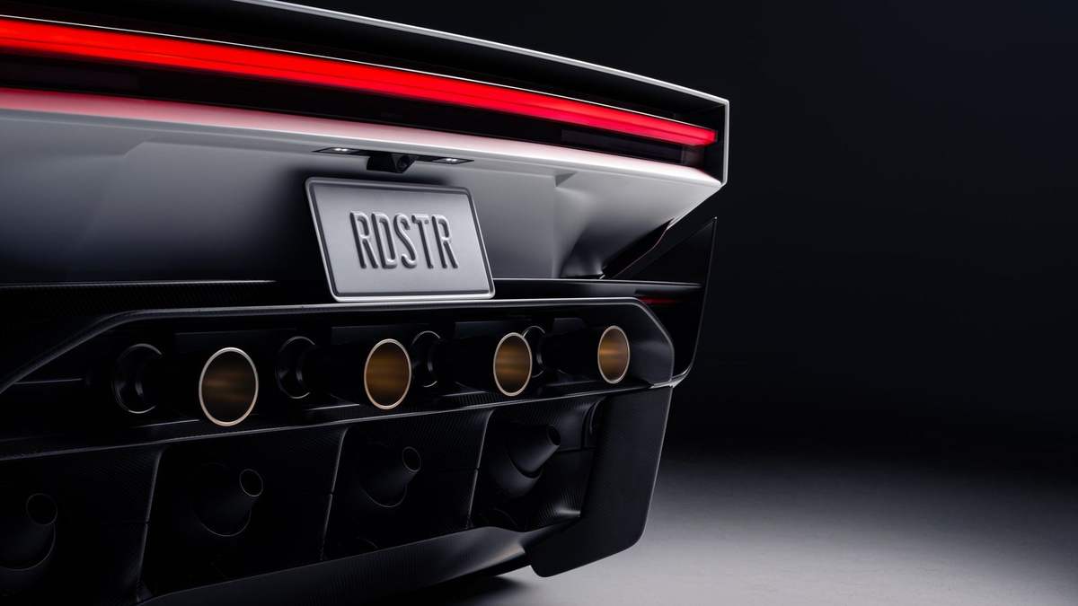 Rear of the Tesla Roadster with the red light bar, diffuser and four thruster nozzles